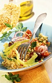 Bulgur salad with peppers, olives and tomatoes
