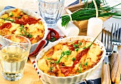 Baked cheese with tomatoes, chili peppers and chives