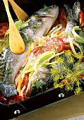 Redfish on bed of vegetables with dill