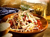 Alsatian sausage salad with cheese and baguette