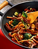 Meat and vegetable ragout in wok
