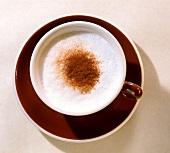 Cappuccino in brown cup