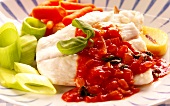 Turbot with tomato and olive sauce and vegetables