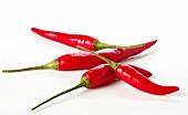 Four red chili peppers