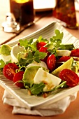 Avocado and mozzarella salad with rocket and cherry tomatoes