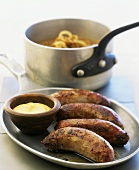 Sausages with mustard and onion sauce, England