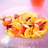 Exotic fruit salad with oranges and almonds