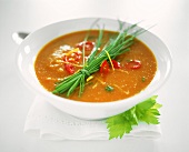 Hearty tomato soup with chili peppers and chives
