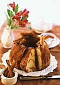 Ring cake with cinnamon, slices cut