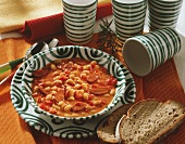 Serbian bean soup with sausage; slices of bread