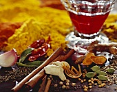 Various exotic spices and glass of red wine