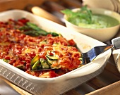 Vegetable casserole: tomatoes, green asparagus & courgettes