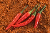 Fresh chili peppers on chili powder
