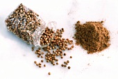 Coriander seeds in bag and ground coriander