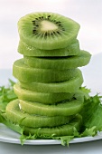 Slices of kiwi fruit in a pile
