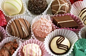 Assorted chocolates in paper cases (filling the picture)