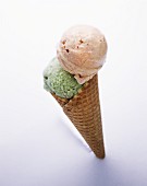 Savoury ices in ice cream cone (green tea- & chilli ice cream)