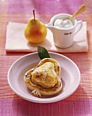 Pear dumpling (in pastry) with cream