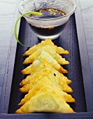 Deep-fried ravioli with courgette filling; soya dip