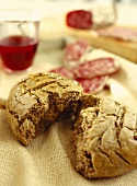 Rye bread with fennel; salami; red wine