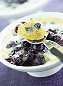 Blueberry pudding with icing sugar