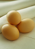Three eggs on fabric napkin