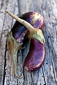 Aubergines on wooden background