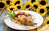 Rabbit in vegetable ragout with offal; sunflowers