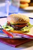 Hamburger on plate with cutlery