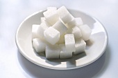 Sugar cubes on plate