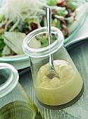Mayonnaise in jar; fresh lettuce leaf