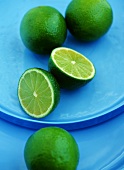 Limes, one halved