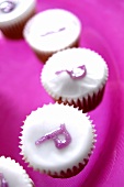 Sweets with glace icing and purple letters
