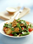 Chicken with sesame, green asparagus and tomatoes