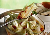 Fennel gratin with tomatoes in baking dish