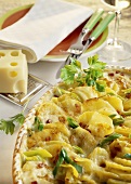 Potato bake with ham, cheese and spring onions