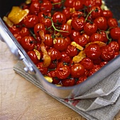 Fried cherry tomatoes with orange peel
