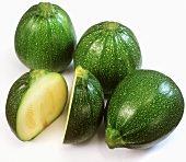 Round courgettes, one halved