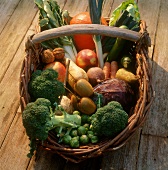 Winter vegetables, kiwi fruits and nuts in basket