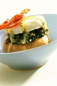 Baked potato with spinach, egg and bacon