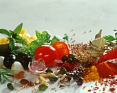 Still life with vegetables, spices, herbs, pine nuts etc.