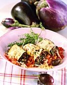 Aubergine rolls with rice and olive filling
