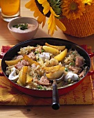 Pan-cooked potato dish with sauerkraut and smoked pork loin