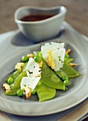 Mangetout pea salad with honey, nuts and pecorino shavings