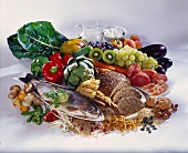 Mixed still life with vegetables, fruit, meat, fish etc.
