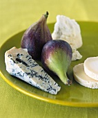Various types of cheese and fresh figs