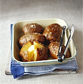 Oven-baked potatoes with butter and salt