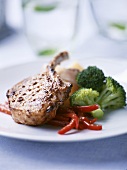 Pork chop with mustard glaze, broccoli and peppers