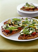 Pizza with avocado, tomatoes and basil