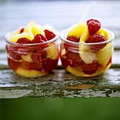 Fruit salad of raspberries and yellow plums